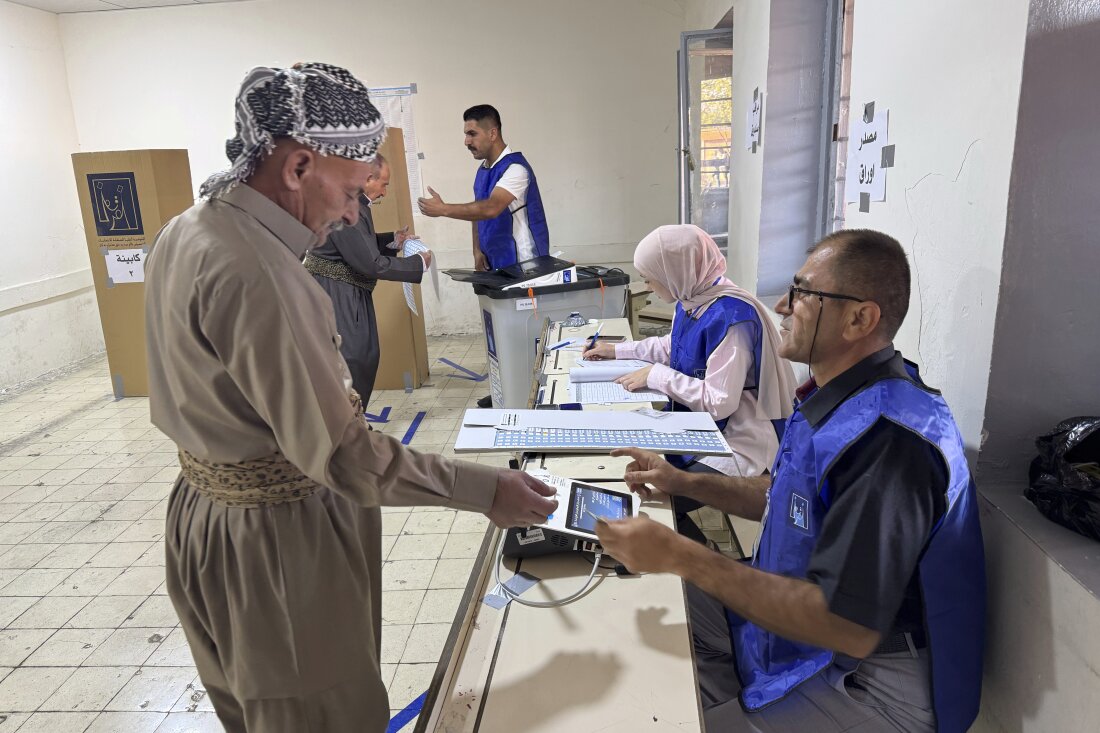 A man registers to vote during parliamentary elections in Iraq's autonomous Kurdish region of Irbil on Sunday.